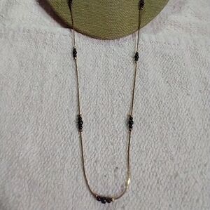 Goldtone black beaded chain necklace
